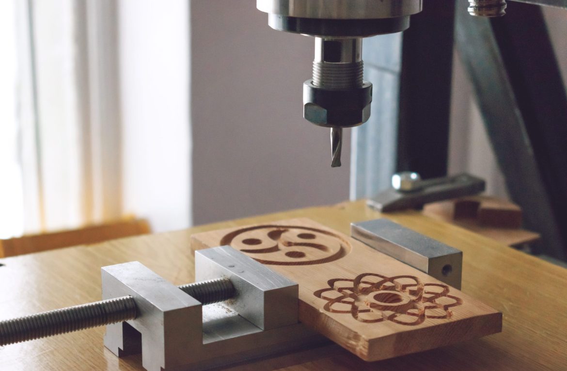 wood cutting machine 3D wood cnc router. CNC milling machine car wood cutting machine 3D wood cnc router. CNC milling machine carving a wooden part blank. Cutter controlled by computer while he is carving wood.